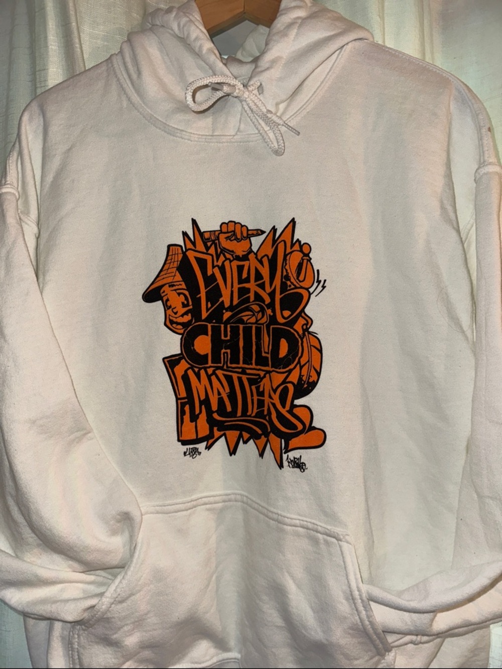 White Hoodie with Orange Graphic - Every Child Matters